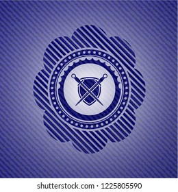swords crossed with shield icon inside emblem with denim high quality background