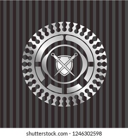 swords crossed with shield icon inside silver emblem