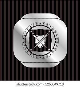 swords crossed with shield icon inside silvery badge or emblem