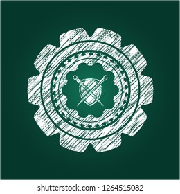 swords crossed with shield icon inside chalkboard emblem written on a blackboard