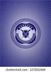 swords crossed with shield icon inside denim background