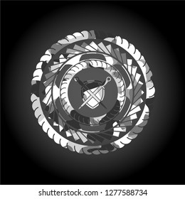 swords crossed with shield icon inside grey camo emblem