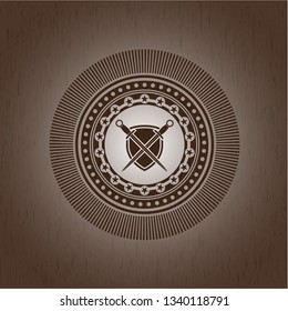 swords crossed with shield icon inside wooden emblem. Vintage.