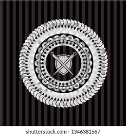 swords crossed with shield icon inside silvery shiny badge