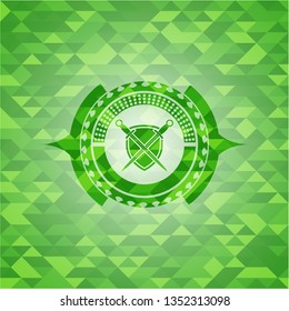 swords crossed with shield icon inside green emblem with mosaic background