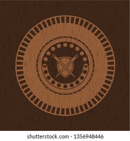 swords crossed with shield icon inside wood badge or emblem