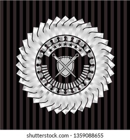 swords crossed with shield icon inside silver emblem