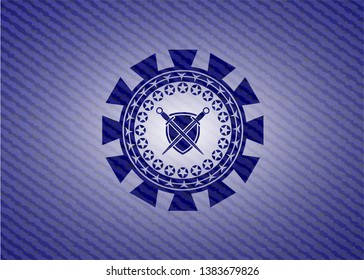 swords crossed with shield icon inside emblem with denim high quality background