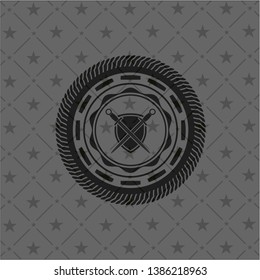 swords crossed with shield icon inside black badge