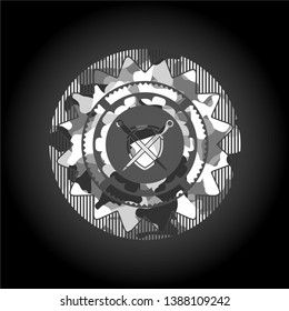 swords crossed with shield icon inside grey camouflage texture