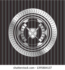 swords crossed with shield icon inside silvery shiny emblem