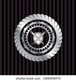 swords crossed with shield icon inside silvery shiny badge