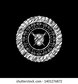 swords crossed with shield icon inside chalkboard emblem written on a blackboard