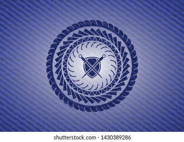 swords crossed with shield icon inside emblem with jean background