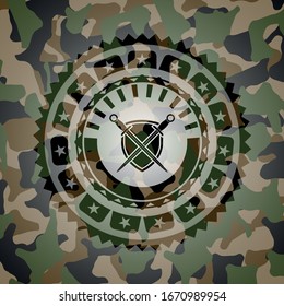 swords crossed with shield icon inside camouflaged emblem