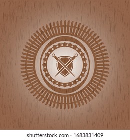 espadas cruzadas con icono de escudo dentro de emblema de madera realista