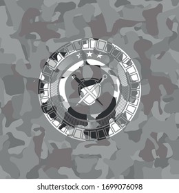 swords crossed with shield icon inside grey camo texture