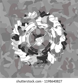 swords crossed with shield icon on grey camo texture