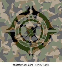 swords crossed with shield icon on camo pattern