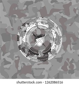 swords crossed with shield icon on grey camouflaged texture