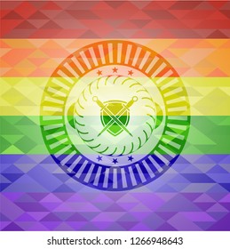 swords crossed with shield icon on mosaic background with the colors of the LGBT flag