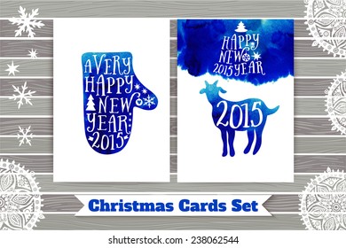 Symbol of the 2015 year, greeting card with goat. Greeting card 2015. Happy New Year 2015. Vector watercolor mitten silhouette, Happy New Year lettering, typography composition. Wood texture.