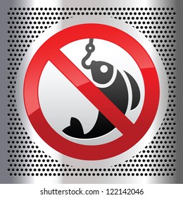 Symbol fish on a metallic perforated stainless steel sheet