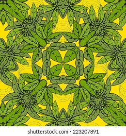 Symmetric colorful seamless pattern of green leaves on a yellow background