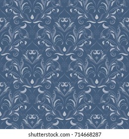 Symmetric seamless blue pattern. Decorative background in Baroque style. The rich decor of the shapes and lines for design of cloth or paper. Vector illustration.