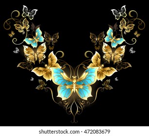 Symmetrical pattern of gold jewelry butterflies on black background.