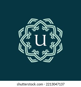 symmetrical and sophisticated flower petal letter U logo. technological and modern floral emblem. lotus flower alphabet emblem