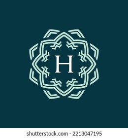 symmetrical and sophisticated flower petal letter H logo. technological and modern floral emblem. lotus flower alphabet emblem