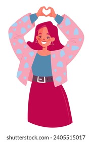 Sympathy, love, approval sign, friendly and welcoming gesture. Girl expresses love with her hands, making a heart-shaped gesture with her fingers. Smiling young woman with gesture of appreciation, lov