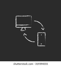 Synchronization computer with mobile device hand drawn in chalk on a blackboard vector white icon isolated on a black background.