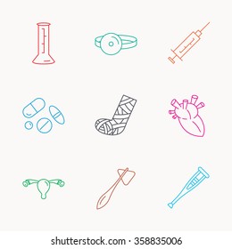 Syringe, beaker and pills icons. Crutch, medical hammer and mirror linear signs. Heart, broken leg and uterus ovary icons. Linear colored icons.