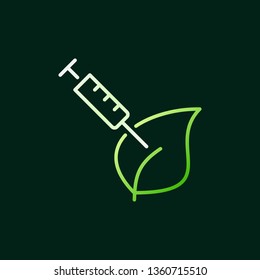 Syringe with green leaf vector modern outline icon or design element on dark background