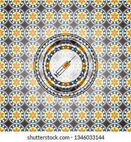 syringe icon inside arabesque emblem background. arabic decoration.