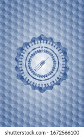 icono de la jeringa dentro del emblema poligonal azul.