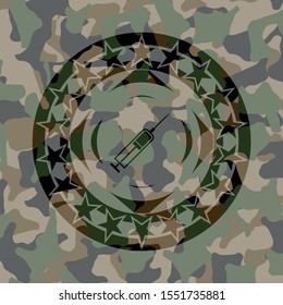syringe icon inside camouflaged emblem