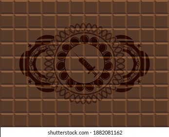 Syringe icon inside chocolate badge. Brown handsome background. Illustration. 