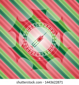 syringe icon inside christmas badge.