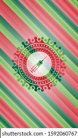 syringe icon inside christmas colors style emblem.