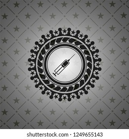 syringe icon inside dark badge or emblem