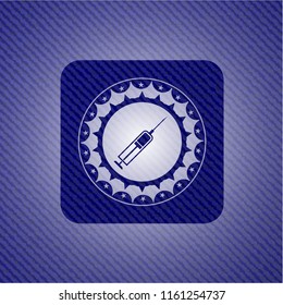 syringe icon inside denim background