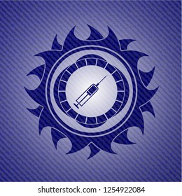 syringe icon inside emblem with jean texture