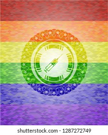 syringe icon inside emblem on mosaic background with the colors of the LGBT flag