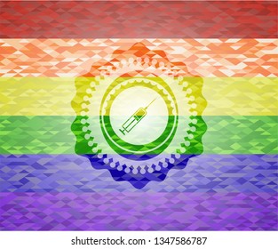 syringe icon inside emblem on mosaic background with the colors of the LGBT flag