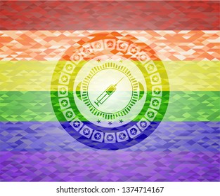 syringe icon inside emblem on mosaic background with the colors of the LGBT flag