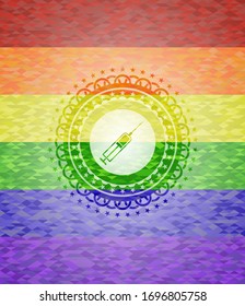 syringe icon inside emblem on mosaic background with the colors of the LGBT flag