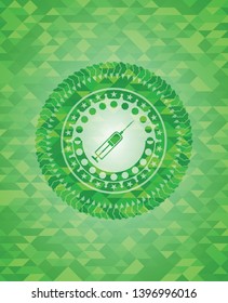 syringe icon inside green emblem with mosaic ecological style background